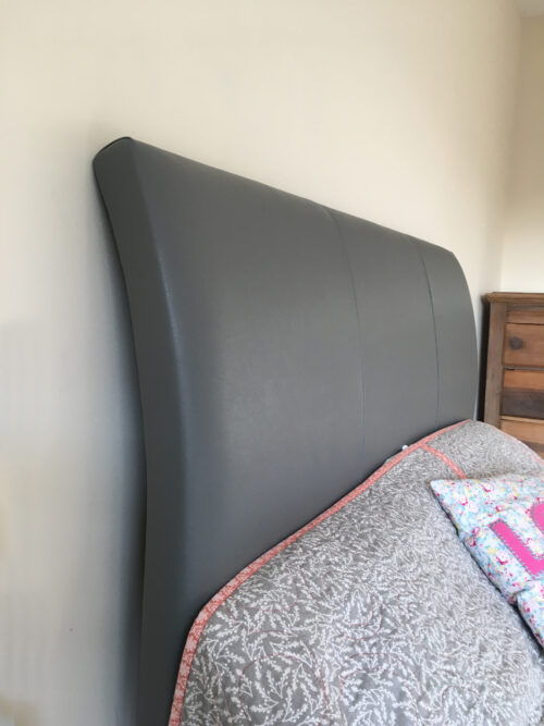 Heritage curved leather headboard detail view